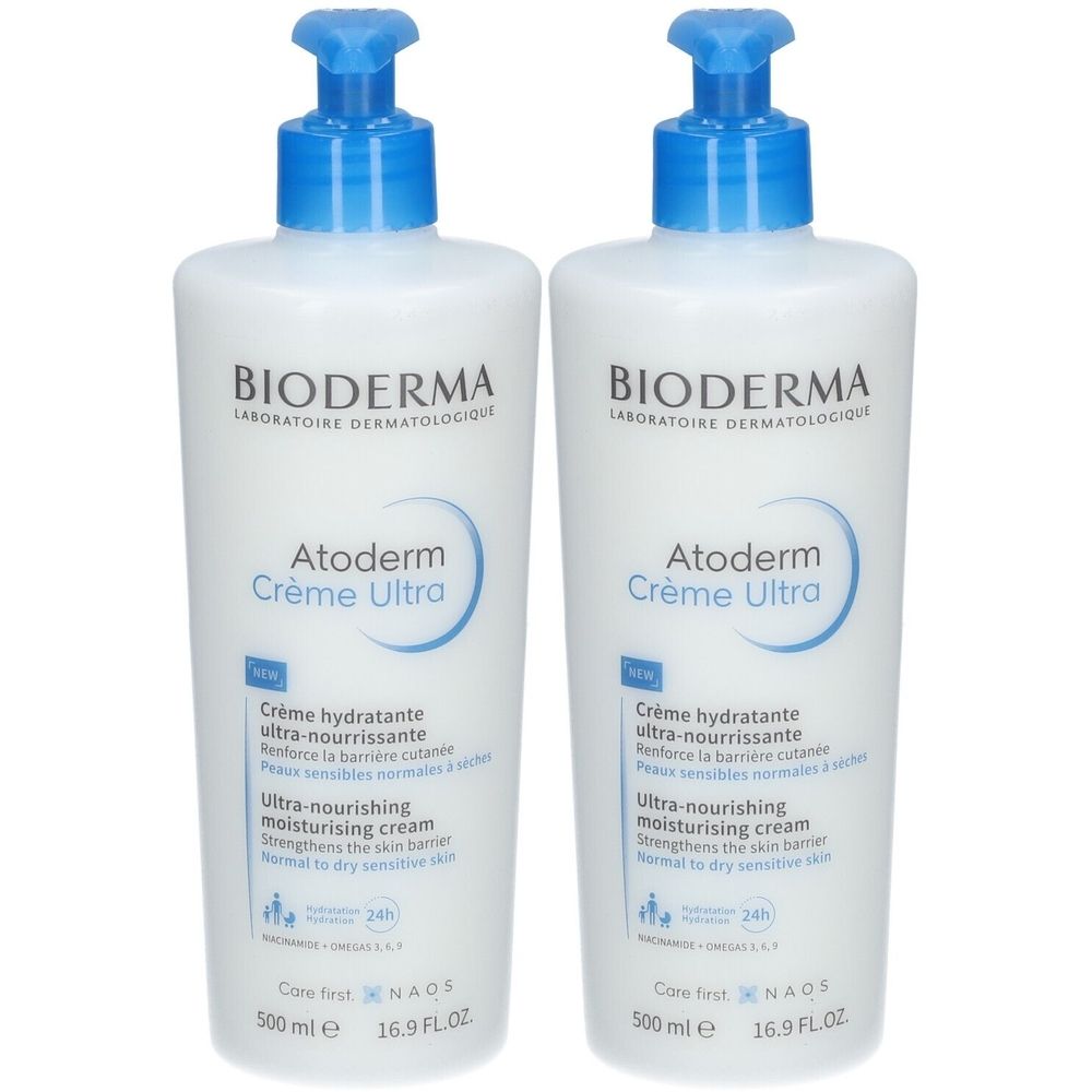 Deux flacons blancs avec pompe bleue. Inscription: BIODERMA Atoderm Crème Ultra. Texte en français et anglais. 500 ml.