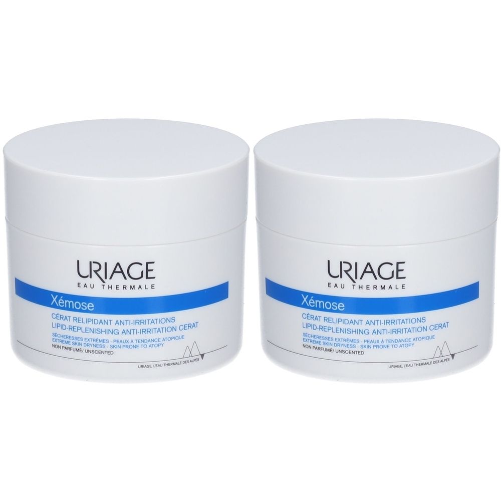Deux pots blancs avec couvercles. Inscription: URIAGE, Xémose, Cérat relipidant anti-irritations. Ligne horizontale bleue.