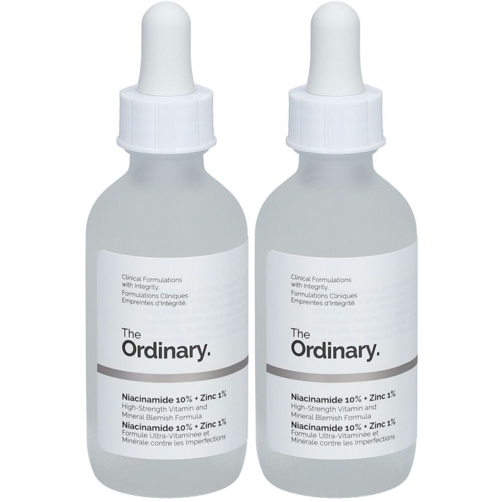 Deux flacons avec compte-gouttes. Les étiquettes indiquent "The Ordinary" et "Niacinamide 10% + Zinc 1%".
