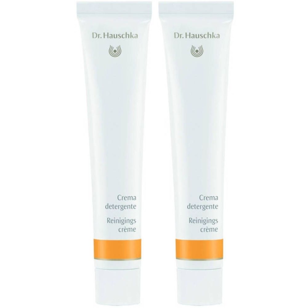 Deux tubes de Crème Purifiante. Blancs, avec bande orange et logo Dr. Hauschka. Inscription : Crema detergente, Reinigings crème.