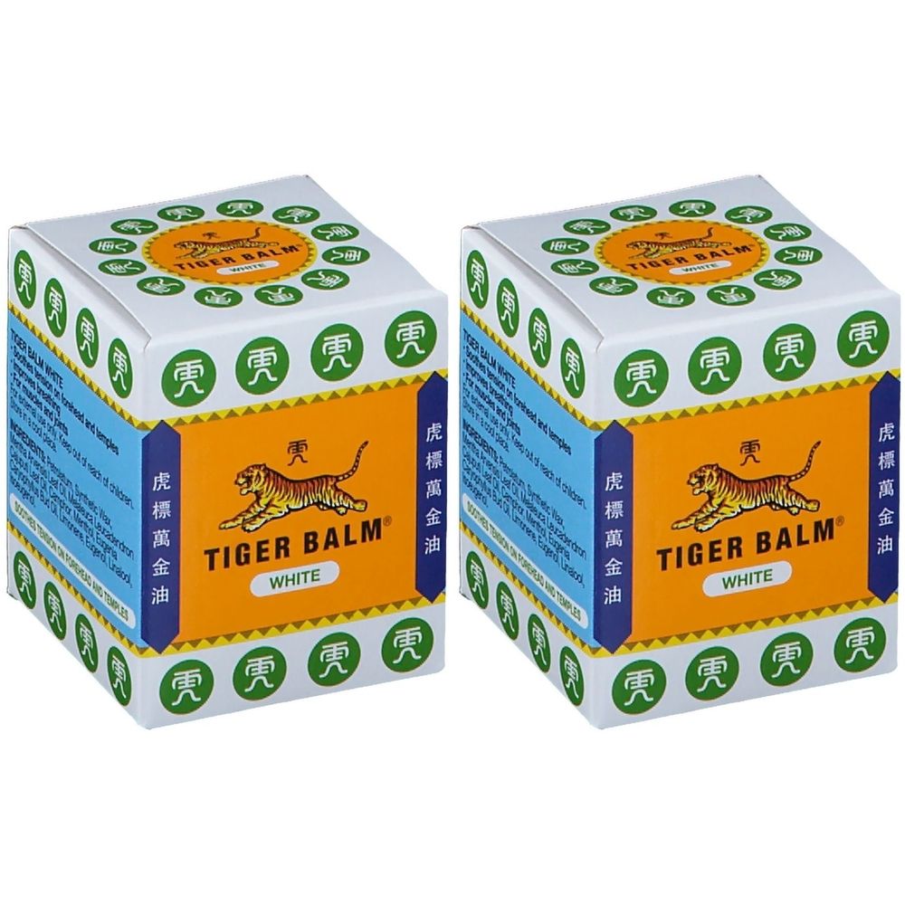 Deux boîtes carrées avec couvercle blanc et face orange. Inscription : TIGER BALM WHITE. Logo : Tigre.