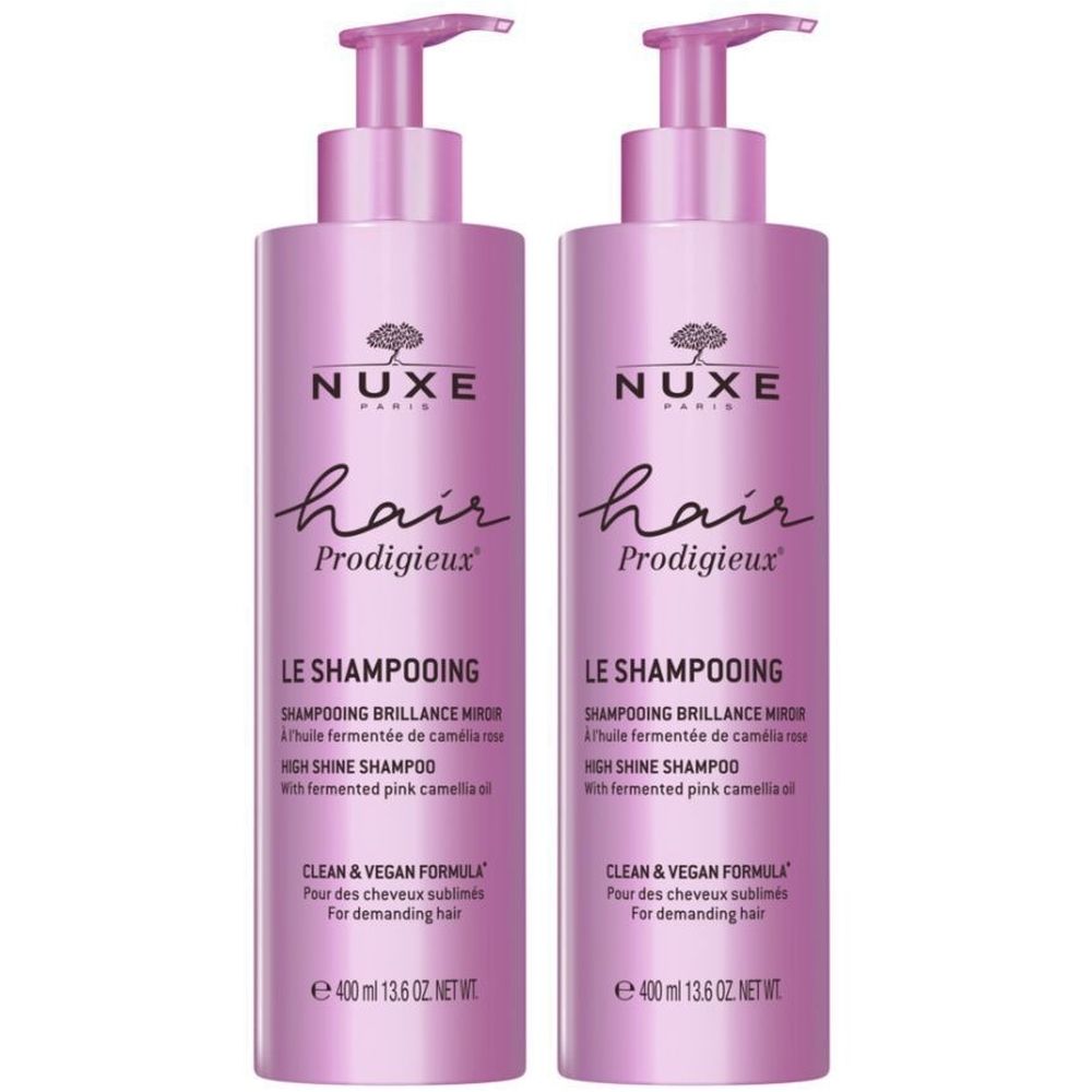 Deux flacons de shampooing roses avec pompe. Inscription : Nuxe Hair Prodigieux, Le Shampooing, High Shine Shampoo.