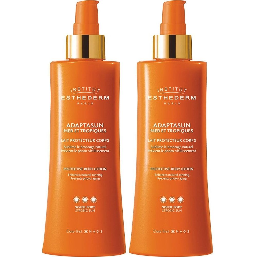 Deux flacons oranges avec pompe. Inscriptions: Adaptasun, Lait protecteur corps, Protective Body Lotion, Soleil Fort. Marque Institut Esthederm.