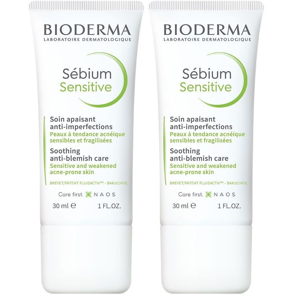 Deux tubes de BIODERMA Sébium Sensitive. Tubes blancs avec texte vert. Texte: Soin apaisant anti-imperfections, 30 ml.