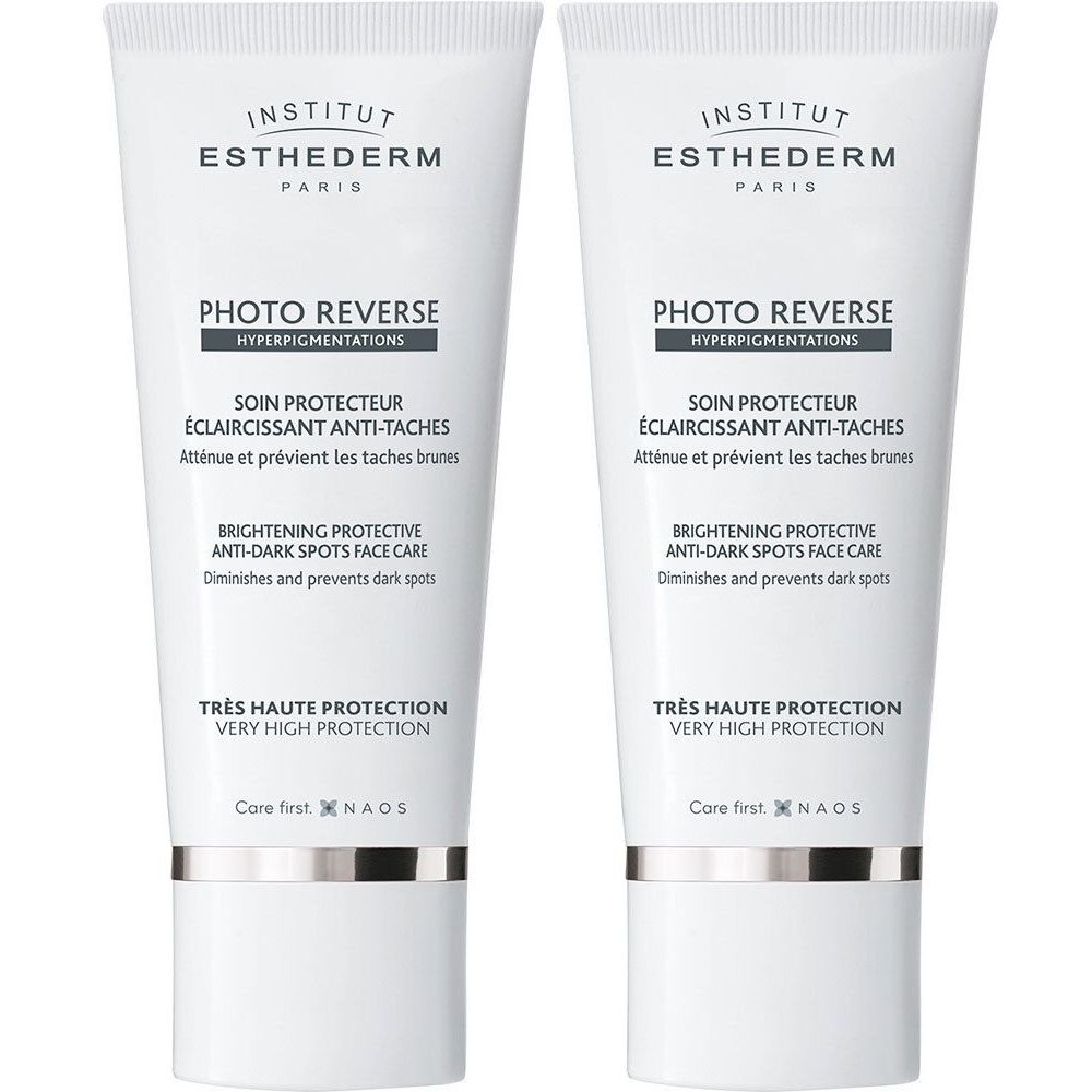 Deux tubes de crème blancs. Inscriptions: PHOTO REVERSE, Soin protecteur éclaircissant anti-taches, Très haute protection. Logo INSTITUT ESTHEDERM.