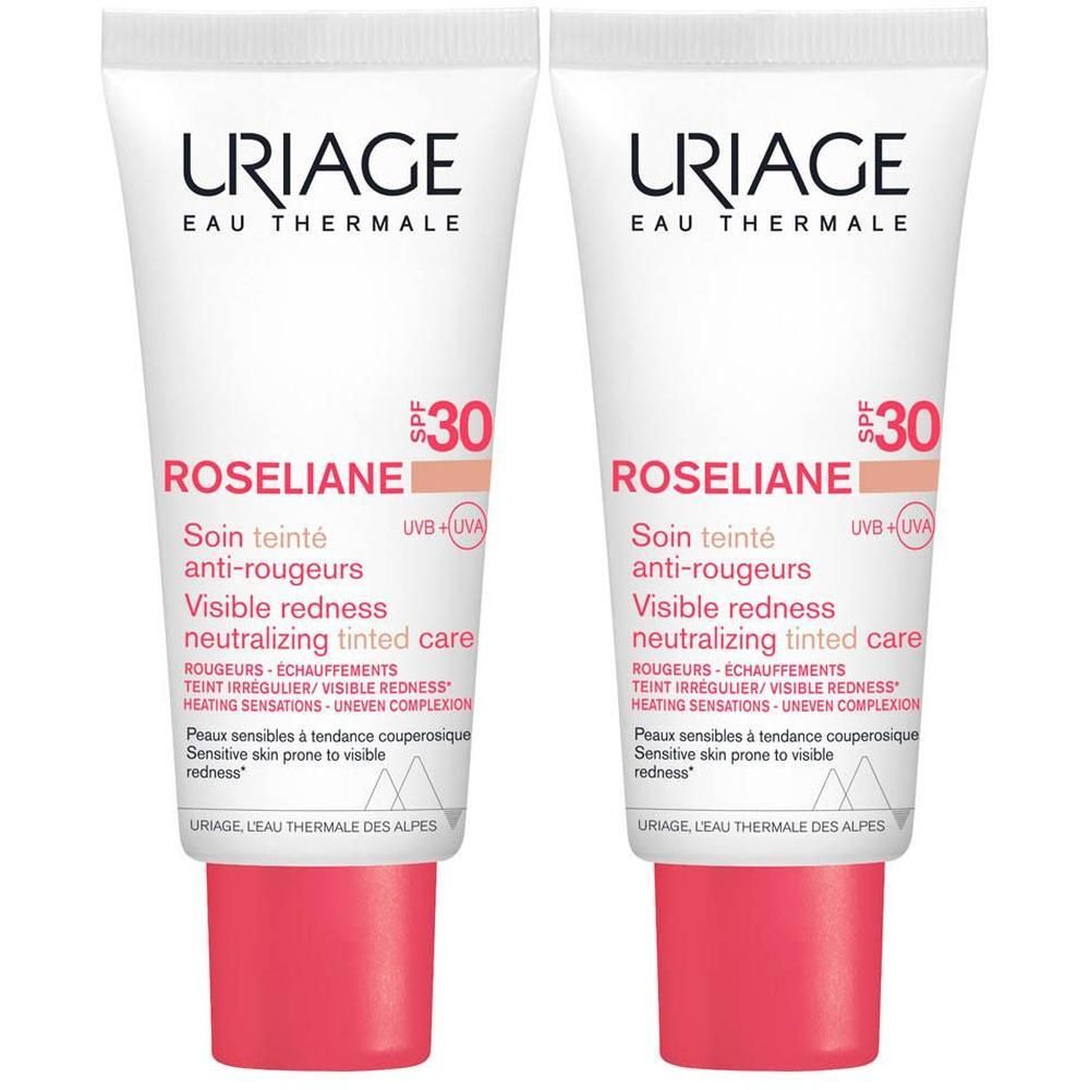 Twee tubes Uriage Roséliane getinte anti-roodheid verzorging. Wit, roze accenten. Tekst: SPF30.
