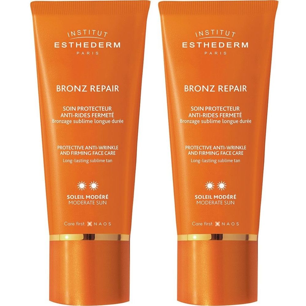 Deux tubes de crème solaire orange. Texte: BRONZ REPAIR, SOLEIL MODÉRÉ. Marque: Institut Esthederm. Protection anti-rides.