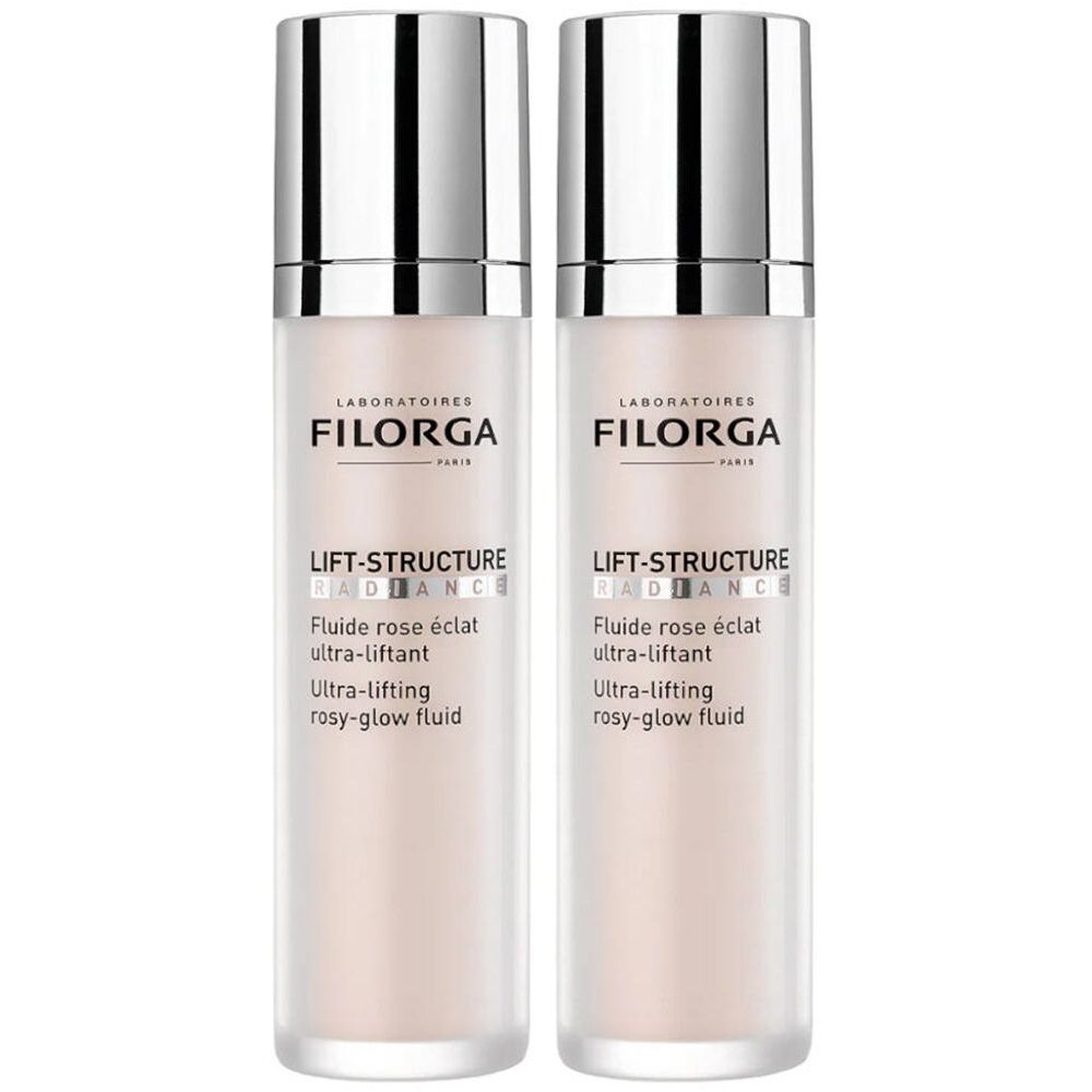 Deux flacons de FILORGA Lift-Structure Radiance. Flacons en verre blanc, bouchons argentés. Inscription : Lift-Structure Radiance, Fluide rose éclat ultra-liftant.