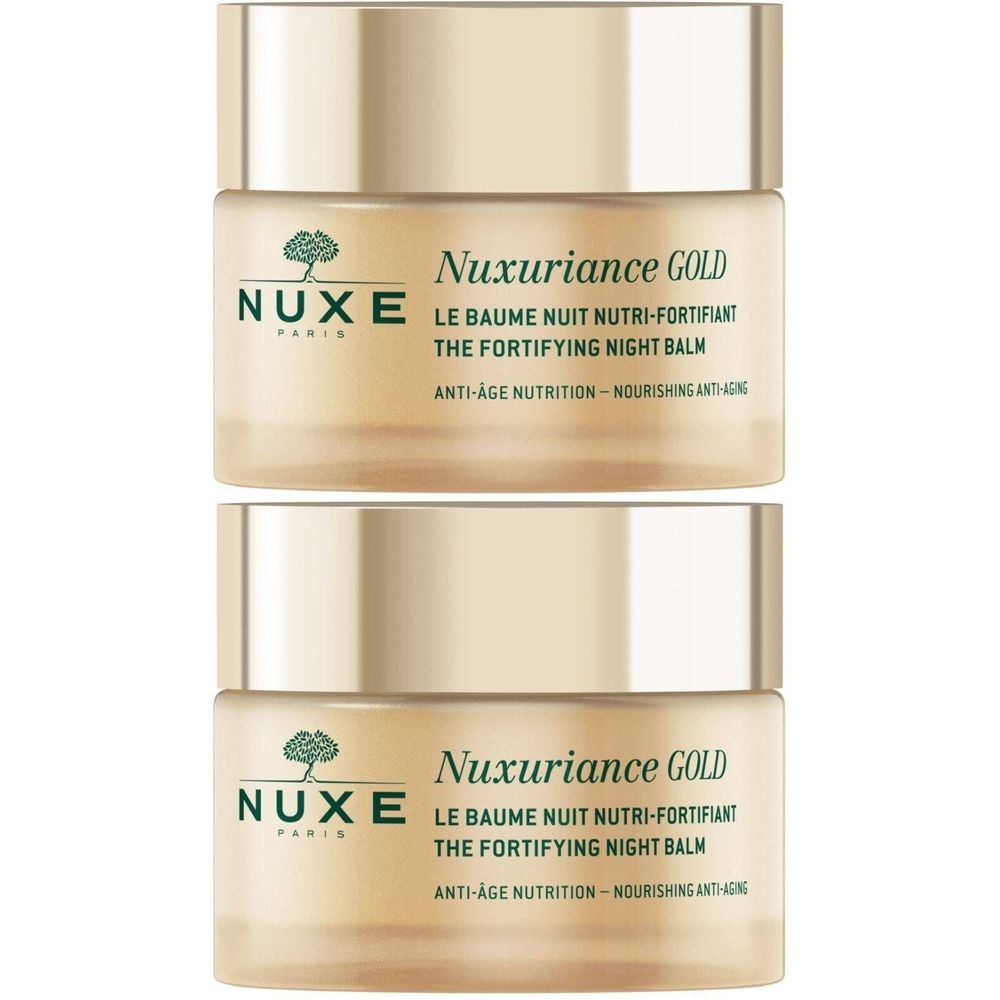 Deux pots dorés. Inscription: Nuxe, Nuxuriance Gold, Le Baume Nuit Nutri-Fortifiant, The Fortifying Night Balm.
