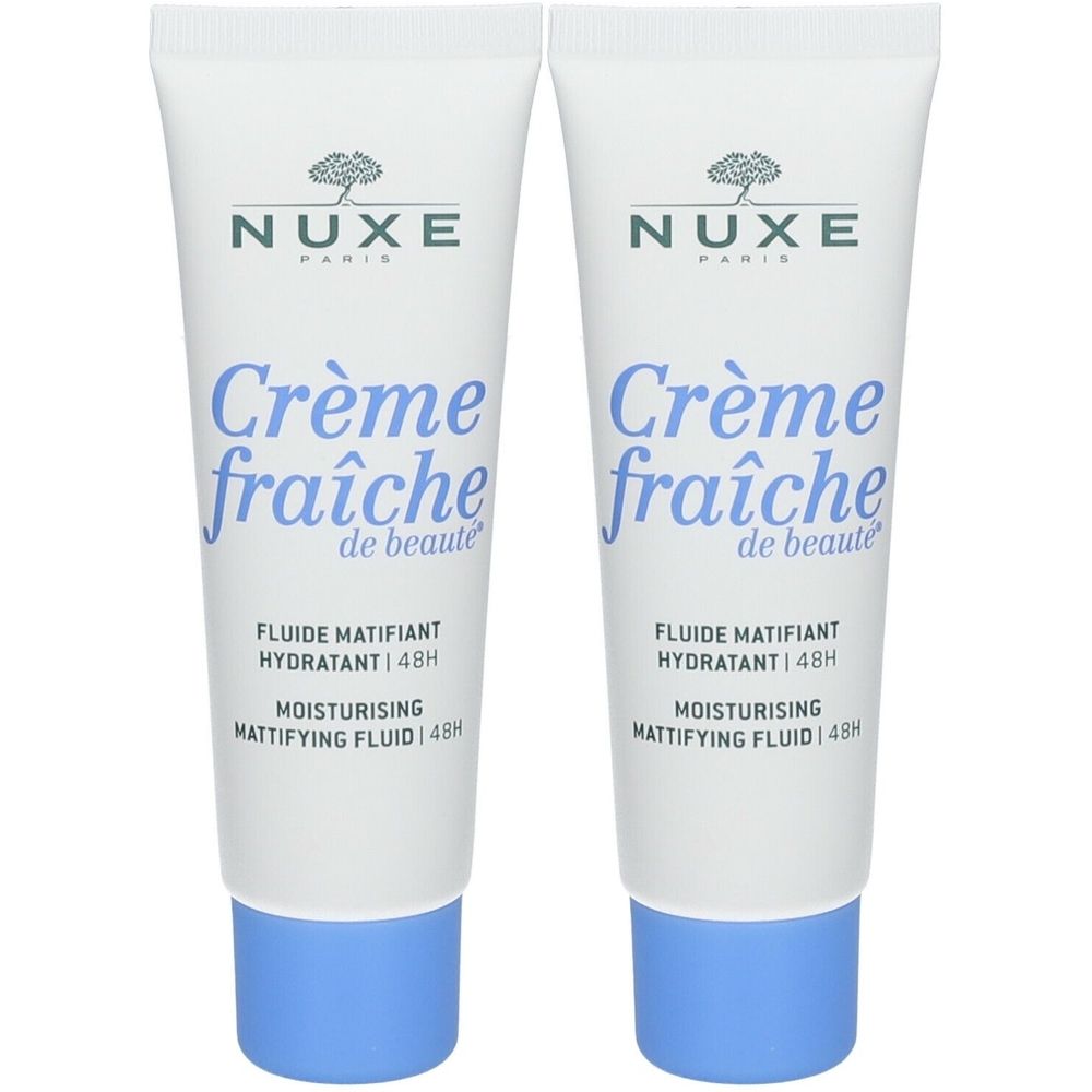 Deux tubes blancs avec texte bleu et bouchons bleus. Inscription : Nuxe Crème fraîche de beauté, Fluide Matifiant Hydratant 48h.