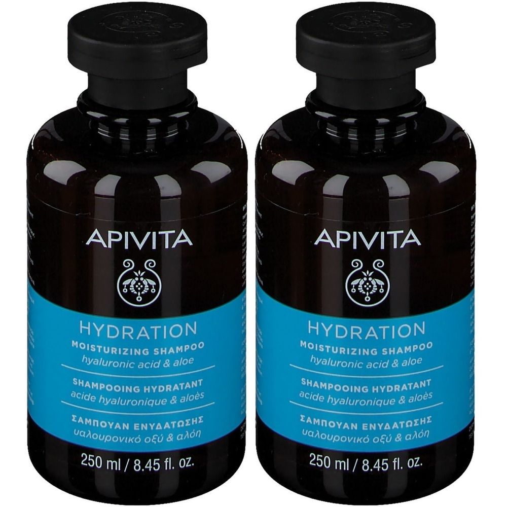 Deux flacons de shampooing APIVITA HYDRATION. Flacons noirs avec étiquette bleue. Texte : HYDRATION, MOISTURIZING SHAMPOO, 250 ml.