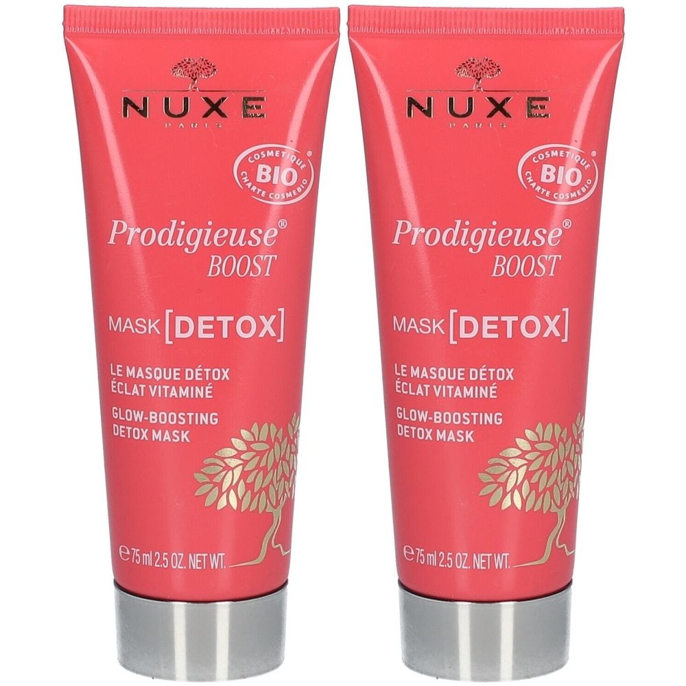 Deux tubes de NUXE Masque Détox Eclat Vitaminé. Tubes roses avec bouchons argentés. Texte : Prodigieuse Boost, Mask [DETOX].