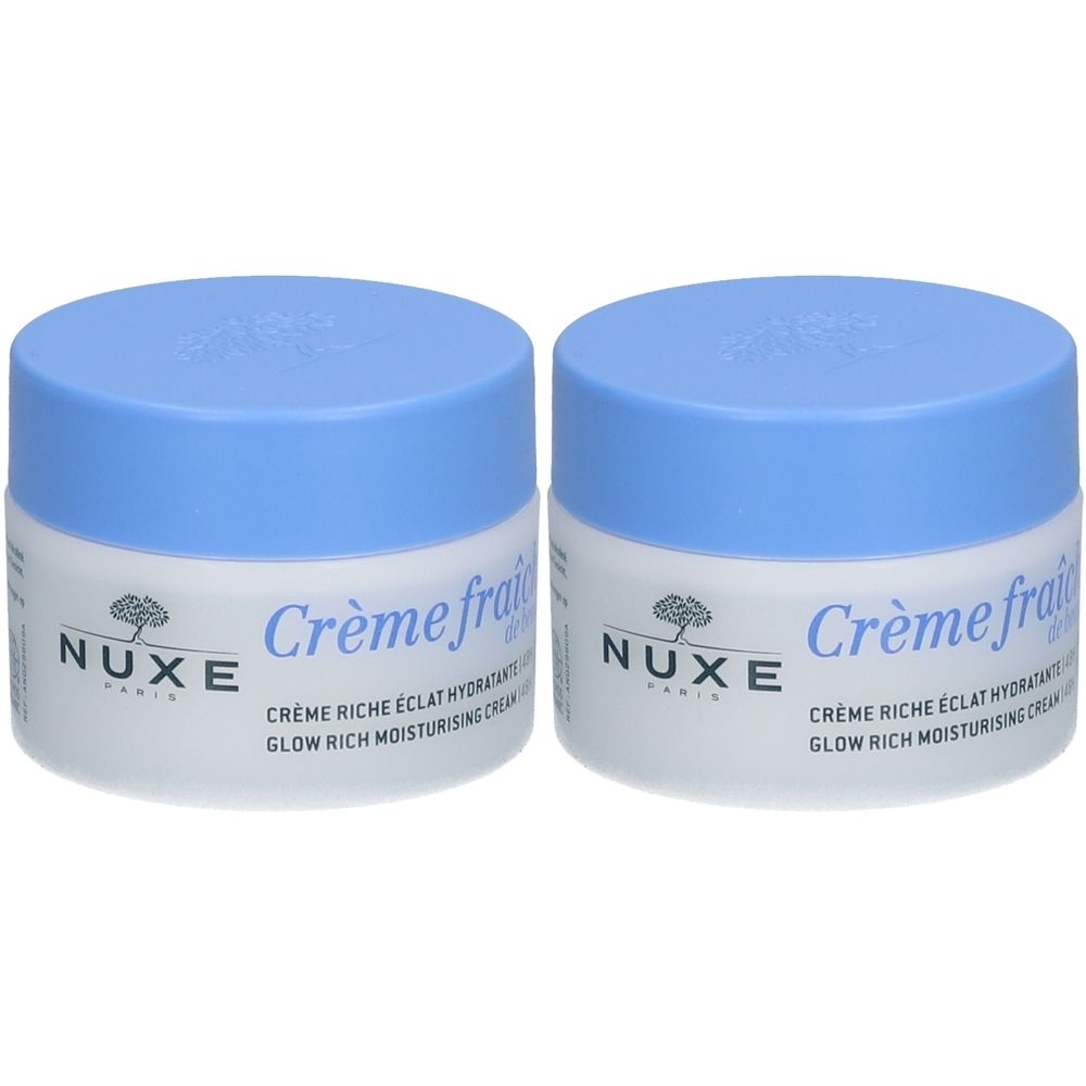 Deux pots de crème avec couvercles bleus. Inscription : NUXE, Crème fraîche de beauté, Crème riche éclat hydratante.