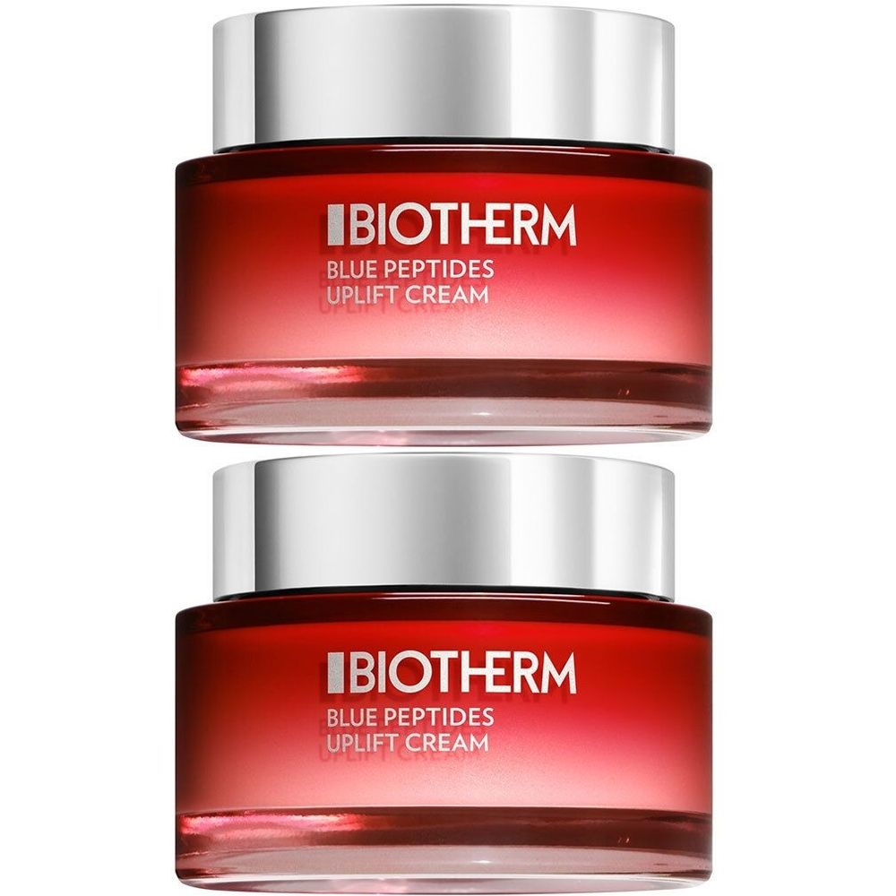 Deux pots de crème avec couvercles argentés. Inscription : Biotherm Blue Peptides Uplift Cream.