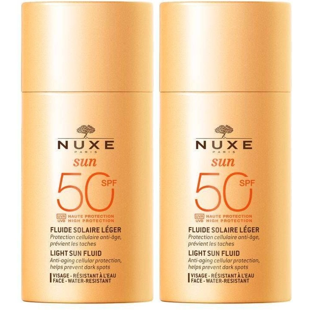 Deux flacons cylindriques NUXE Sun SPF 50. Inscription: Fluide Solaire Léger, Light Sun Fluid. Résistant à l'eau.