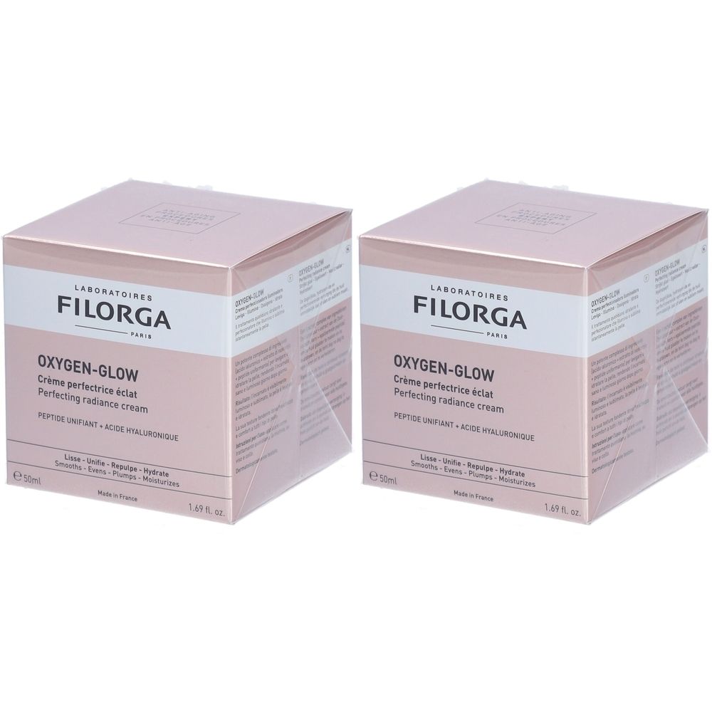 Deux boîtes carrées. Inscription : FILORGA, OXYGEN-GLOW Crème perfectrice éclat, Perfecting radiance cream. Rose et blanc.