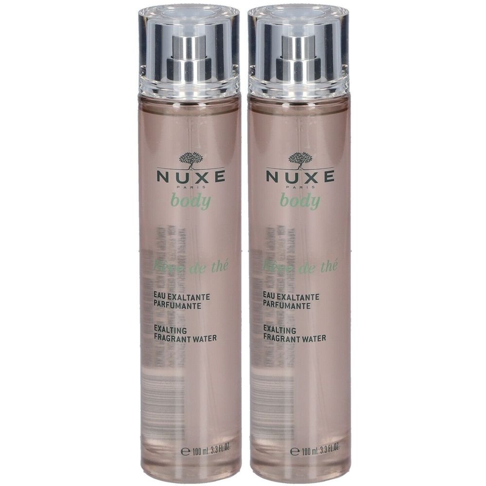 Deux flacons de parfum avec vaporisateur. Inscription: NUXE body, Eau Exaltante Parfumante, Exalting Fragrant Water.