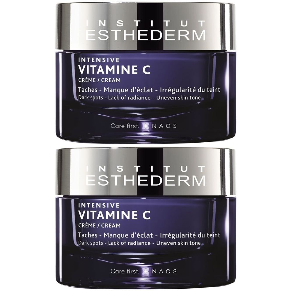 Deux pots INSTITUT ESTHEDERM Intensive Vitamine C. Pot bleu foncé avec couvercle argenté. Texte: Crème, contre les taches.