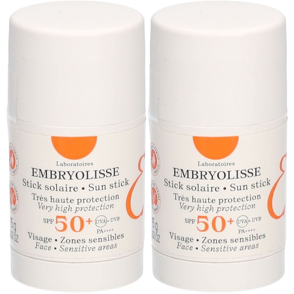 Zwei Embryolisse Stick Solaire SPF50+ Sonnenstifte. Weißer Behälter mit orangefarbenem Akzent. Text: SPF 50+, Très haute protection.