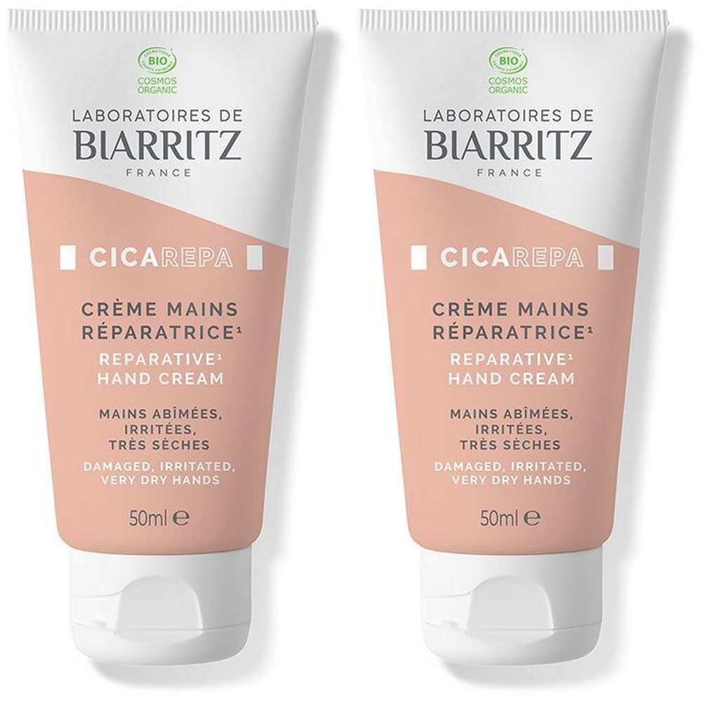 Zwei Tuben Handcreme. Weiß-rosa Tuben mit Text: Laboratoires de Biarritz, Crème Mains Réparatrice, 50ml e. Bio-Siegel.