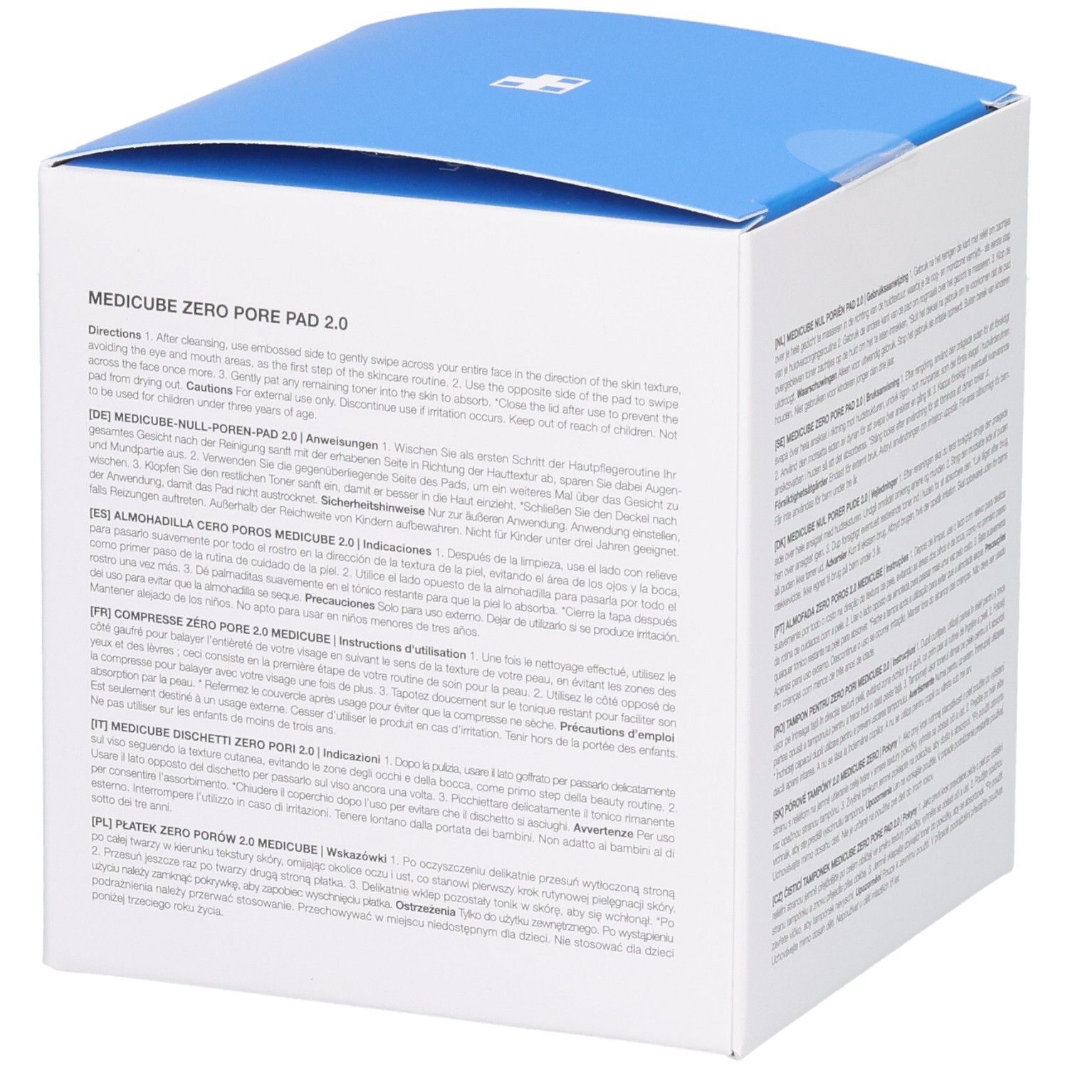 Weiße quadratische Verpackung mit blauem Deckel. Text in mehreren Sprachen, Recycling-Symbole und Gebrauchsanweisungen.