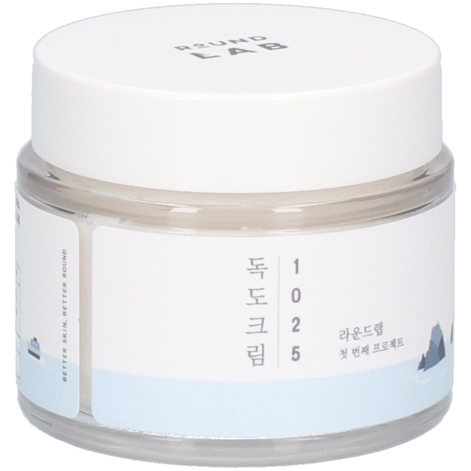 Runde, transparente Dose mit weißem Deckel. Aufkleber mit koreanischem Text und Logo. "ROUND LAB" oben.