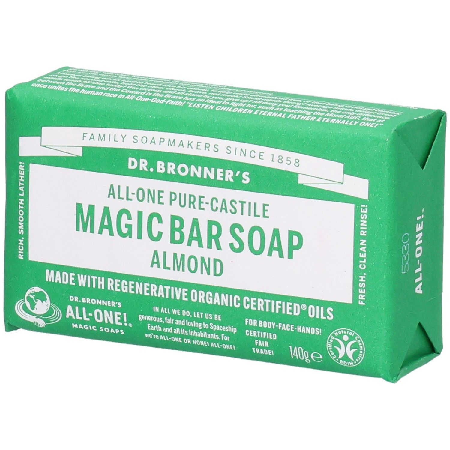 Grüne Seife in Papierverpackung. Aufschrift: Dr. Bronner's Magic Bar Soap Almond. Fair Trade Siegel.