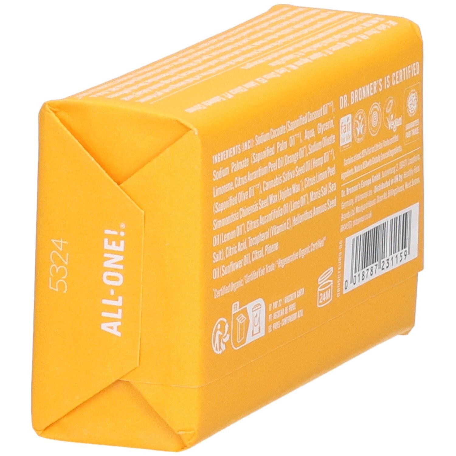 Rückseite eines gelben Seifenstücks. Zutatenliste, Zertifizierungen, Barcode und Herstellerinformationen. Schrägansicht.