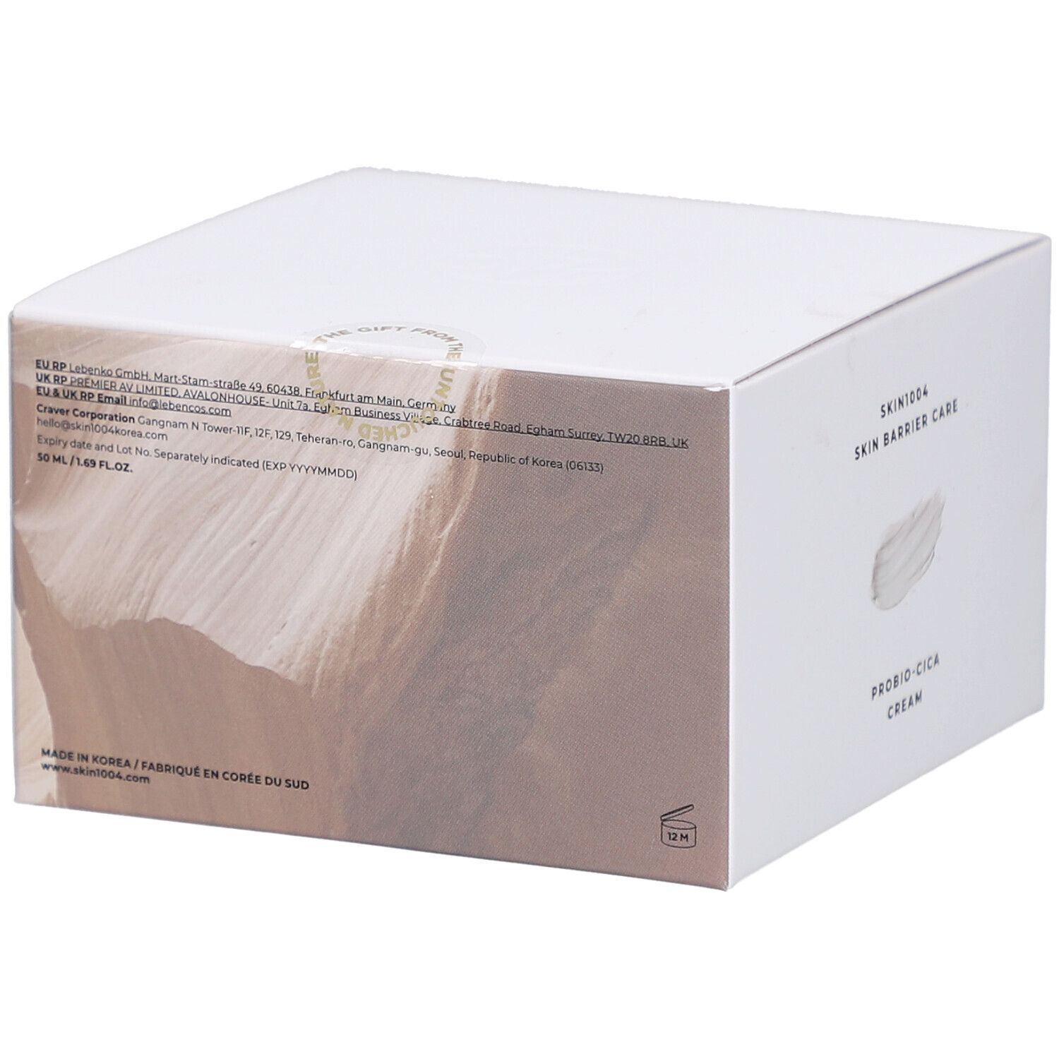 Rückseite des weißen Kartons. Text: SKIN1004, Produktinformationen, Inhaltsstoffe, Herkunft.