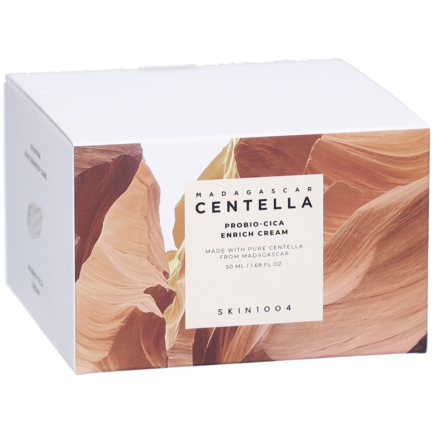 Karton mit Produktinformationen. Text: MADAGASCAR CENTELLA, PROBIO-CICA ENRICH CREAM, SKIN1004.