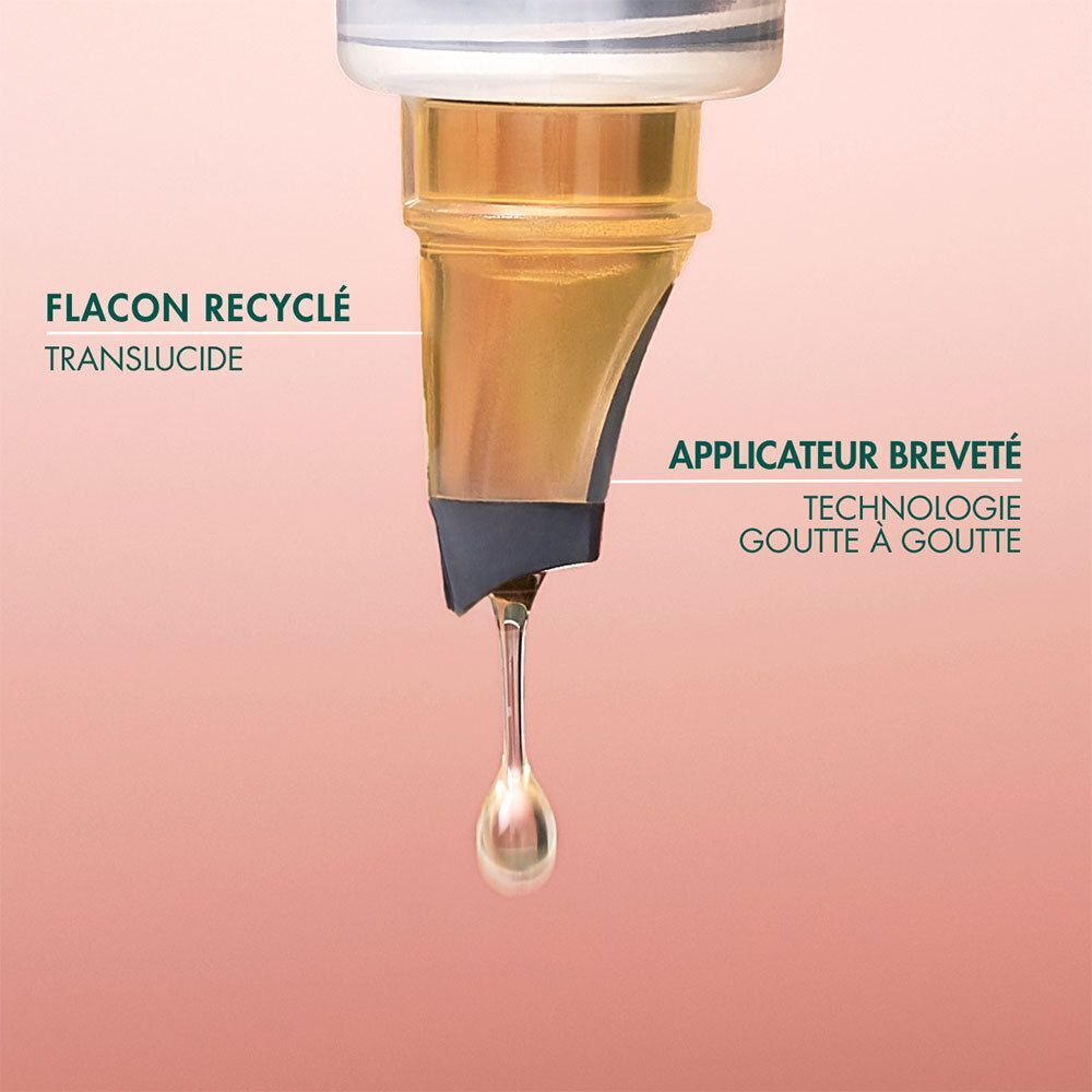 Gros plan du compte-gouttes d'un flacon d'huile Melvita. Flacon recyclé. Applicateur breveté.