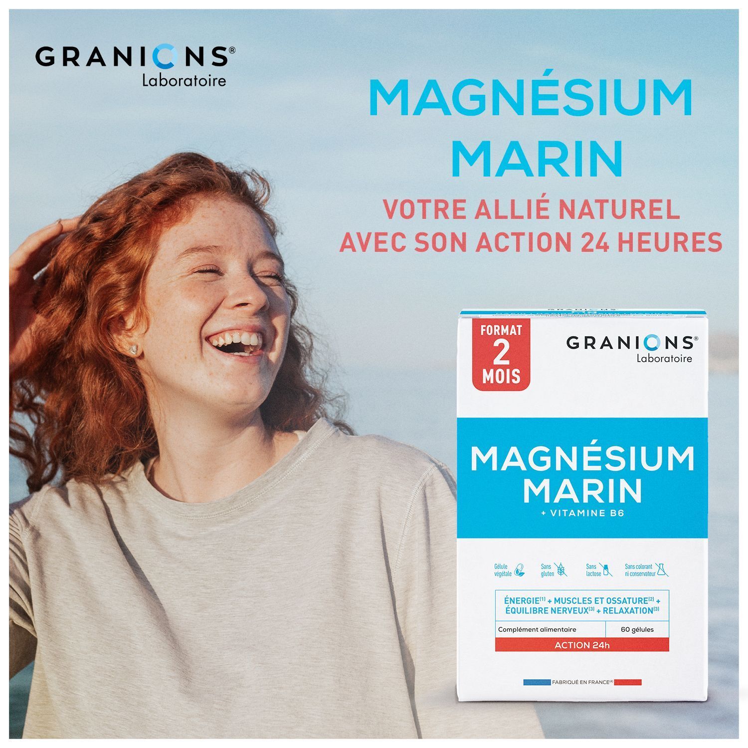 Lächelnde Frau neben einer Packung Granions Magnesium Marin 300 mg mit 24-Stunden-Wirkung.