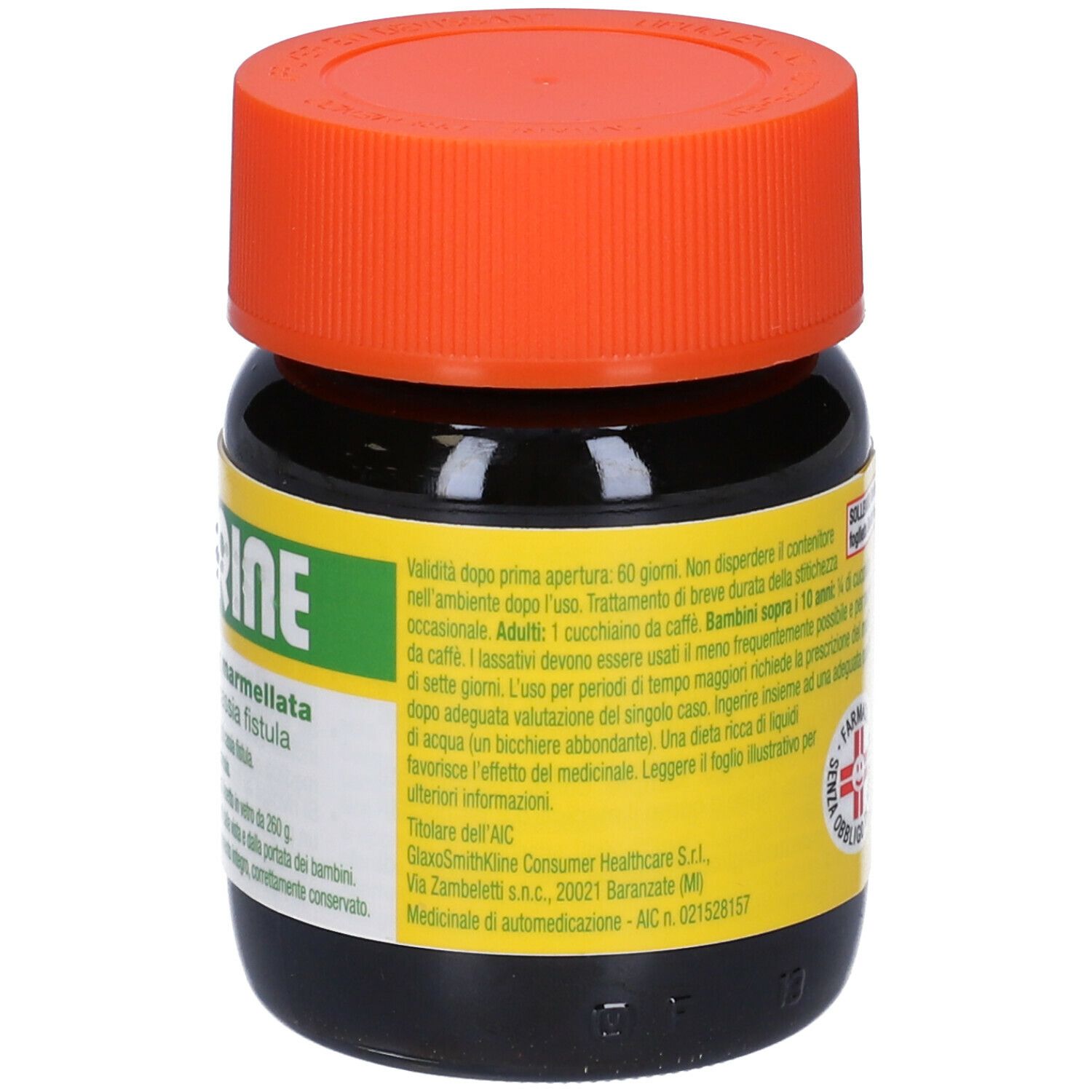 Vasetto di vetro marrone con coperchio arancione. Scritta TAMARINE. Etichetta gialla con informazioni e logo.