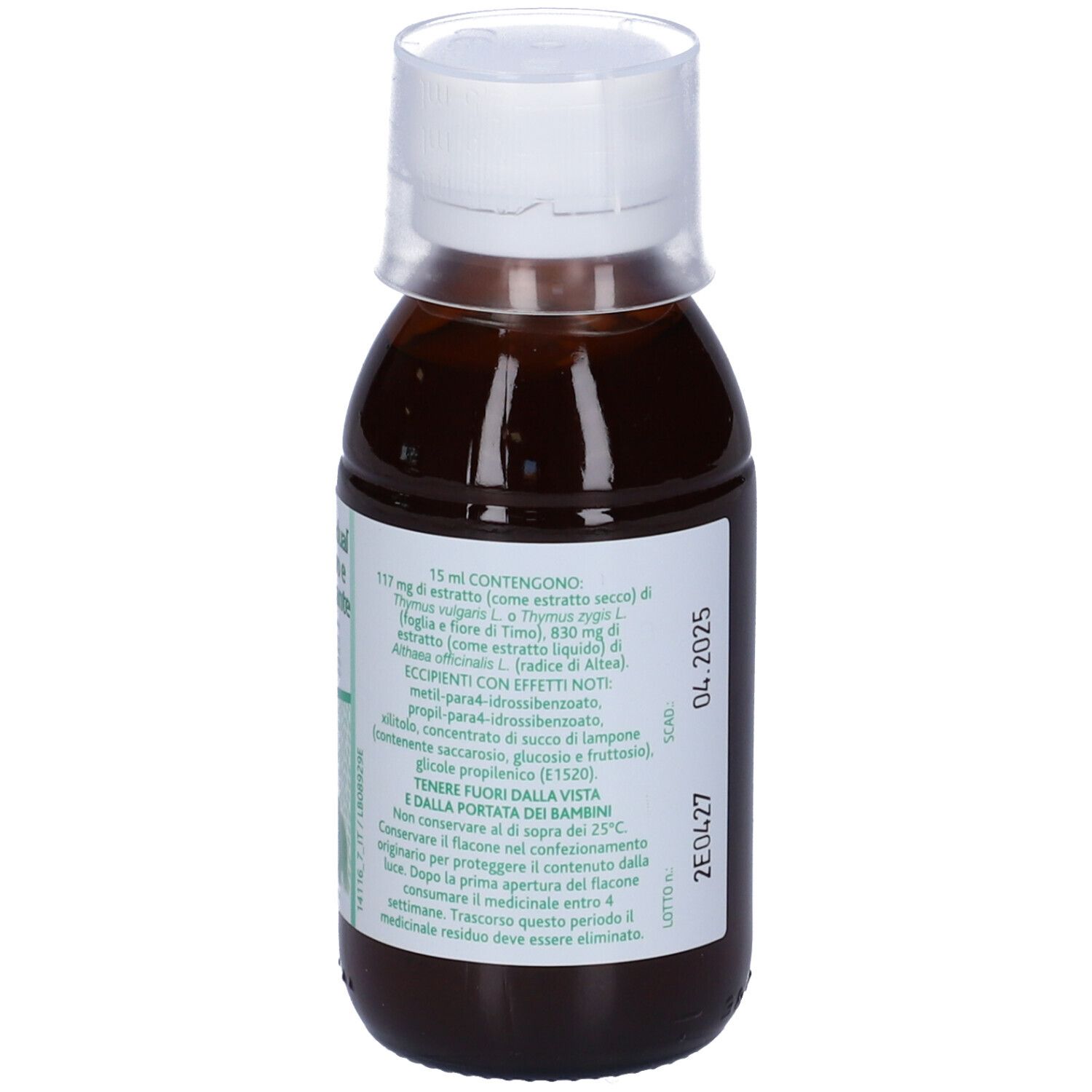 Liquido marrone in bottiglia con tappo bianco. Ingredienti sull'etichetta.