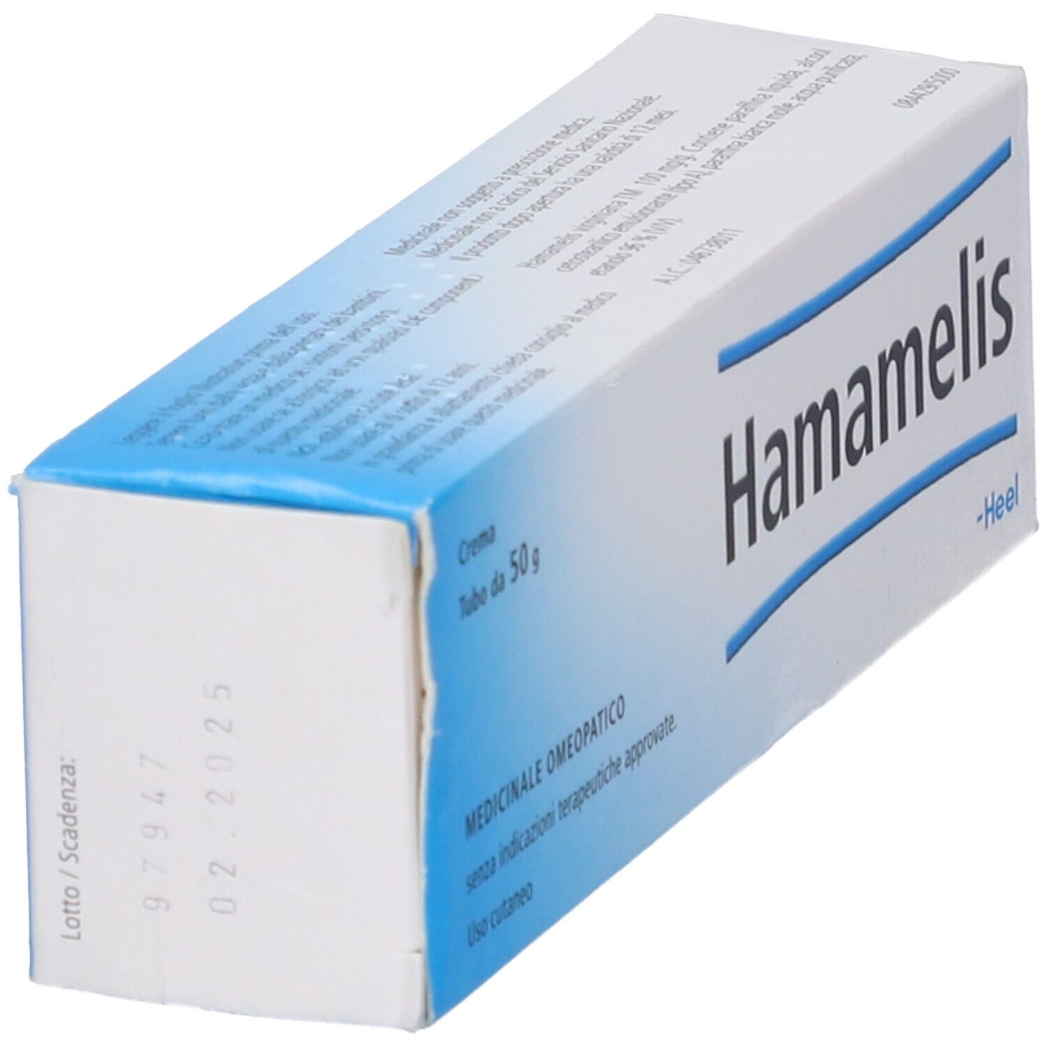 Scatola di crema Hamamelis, in diagonale. Confezione blu e bianca. Testo: Hamamelis, Heel, 50 g.