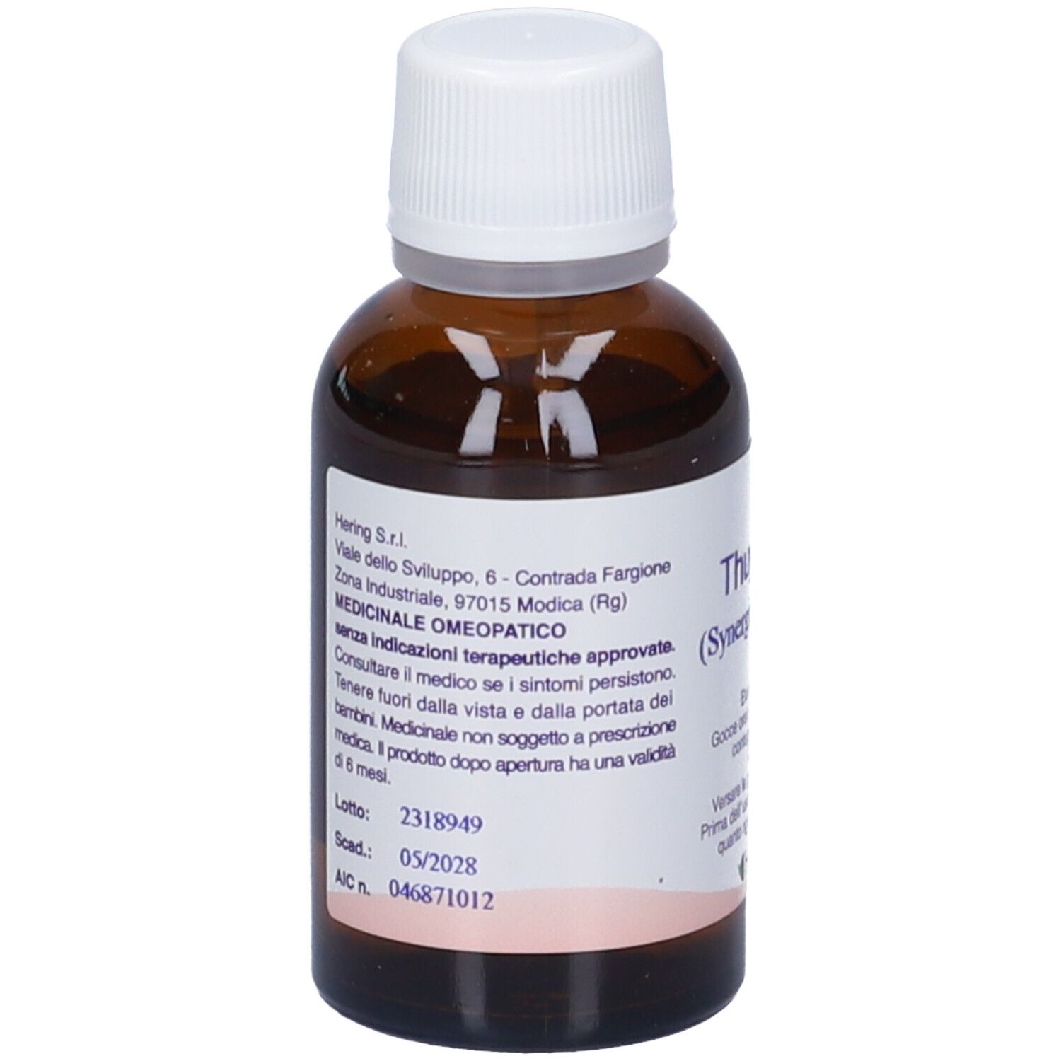 Flacone di vetro marrone con tappo bianco. Scritta: Thuyaplus (Synergipus n. 109), Hering. Gocce.