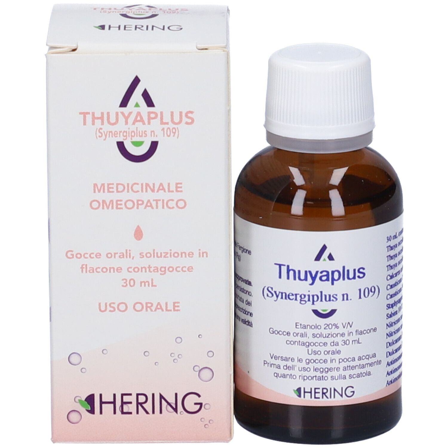 Flacone di vetro marrone con tappo bianco e scatola. Scritta: Thuyaplus, Hering. Gocce medicinali.