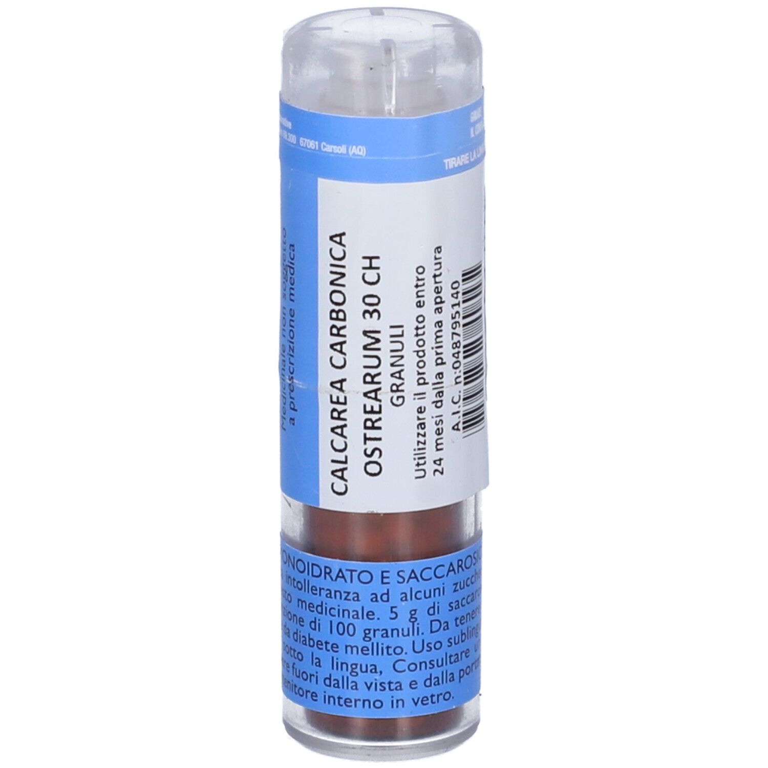 Contenitore multidose cilindrico con granuli. Etichette blu con informazioni. Coperchio trasparente.