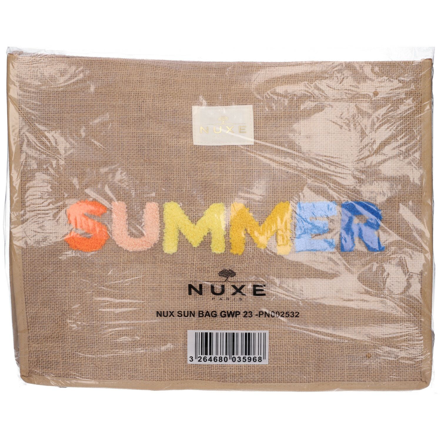 Borsa beige con scritta "SUMMER" multicolore. Logo NUXE e informazioni sul prodotto sulla confezione.
