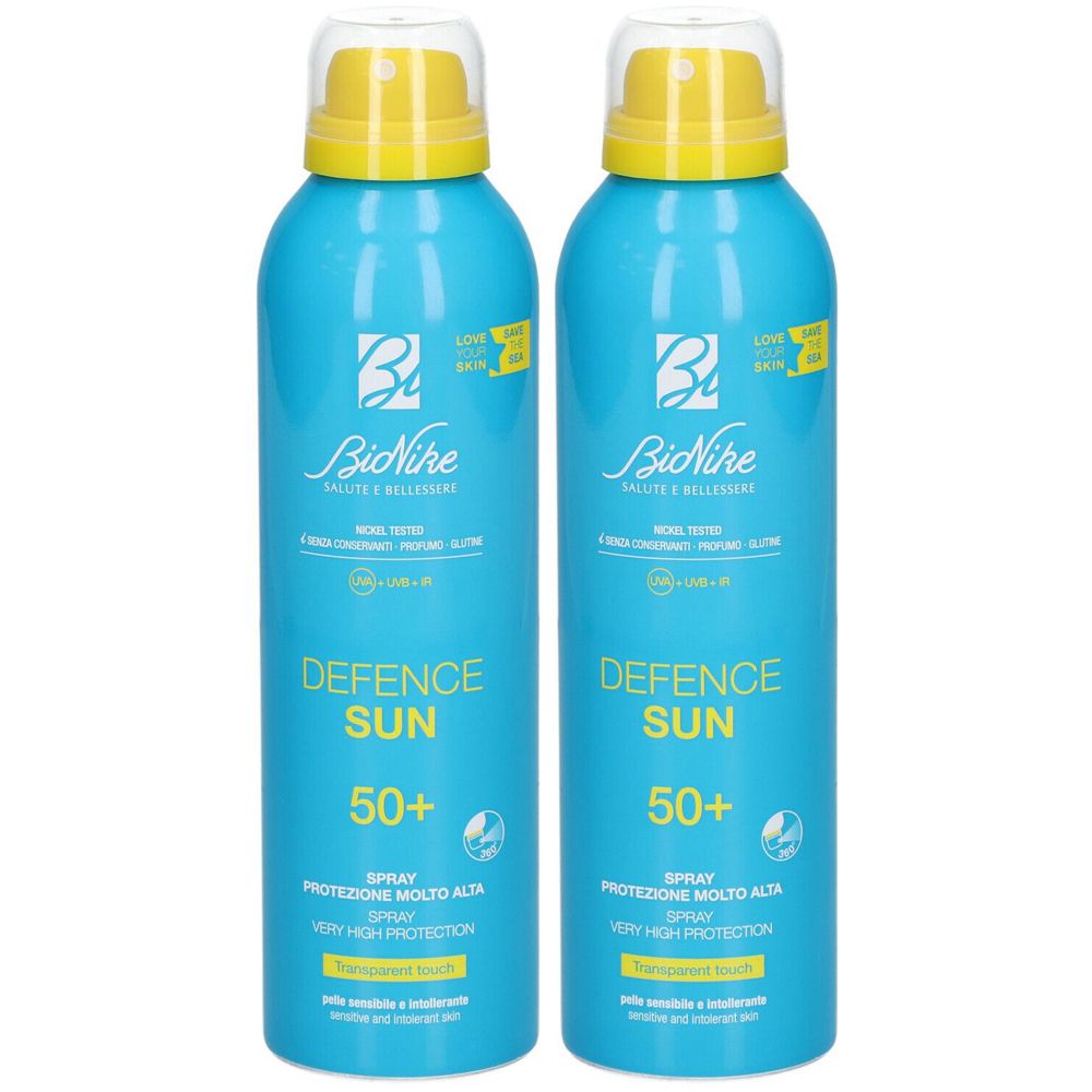 Due flaconi spray blu con tappi gialli. Scritta: Defence Sun 50+ di BiNike.