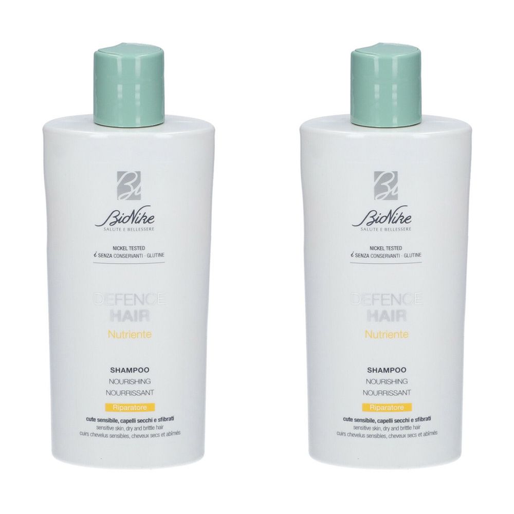 Due flaconi di shampoo bianchi con tappo verde. Scritta: BioNike Defence Hair Shampoo Nutriente.