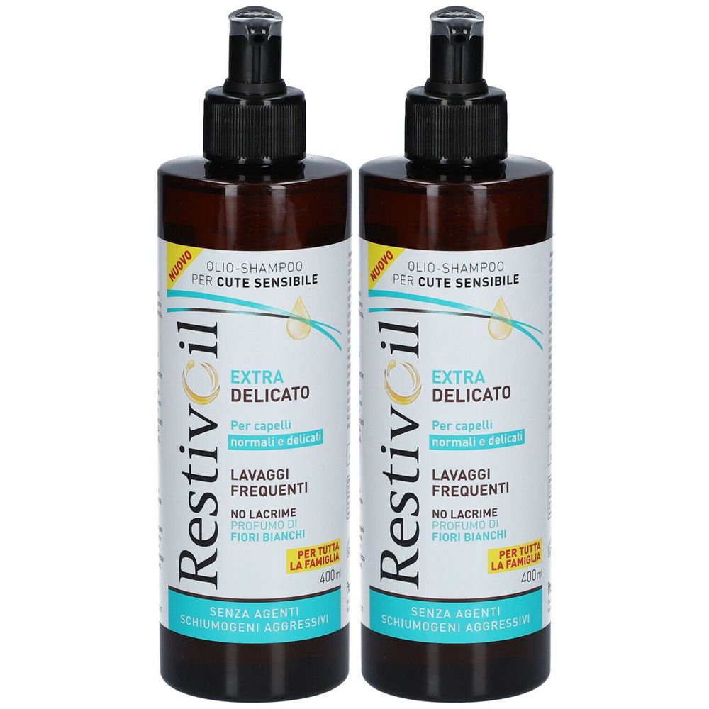 Due flaconi di shampoo Restivoil. Flaconi marroni con dosatore nero. Scritta: Extra Delicato, per cute sensibile.