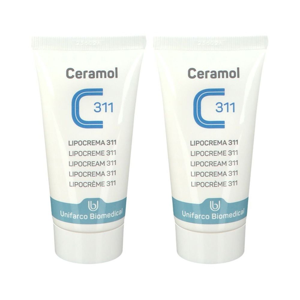 Due tubi di Ceramol Lipocrema 311. Tubi bianchi con testo blu. Scritta: Ceramol, C311, Lipocrema 311. Unifarco Biomedica.