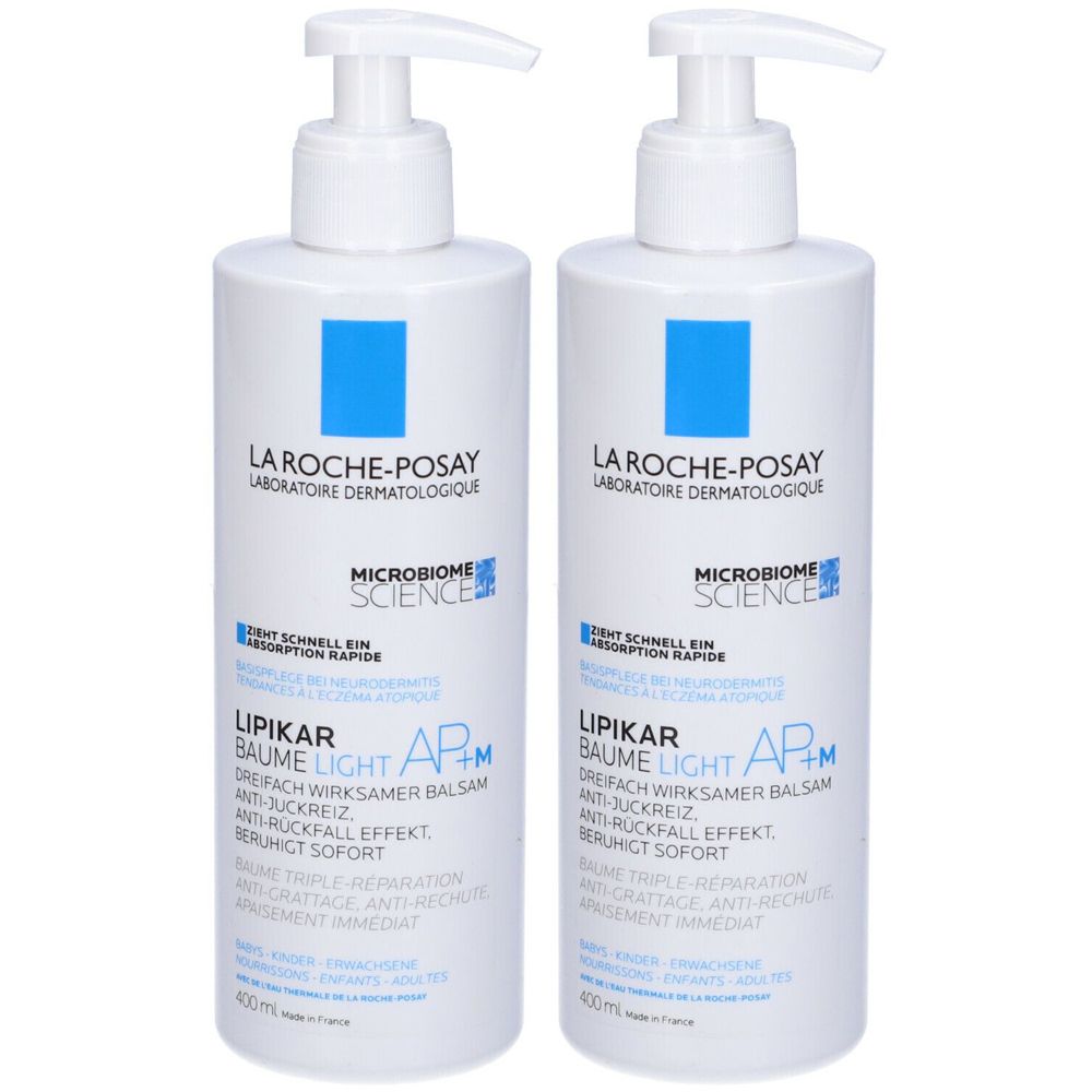 Due flaconi bianchi con dosatore. Scritta: La Roche-Posay, Lipikar Baume Light AP+M. Dettagli blu.