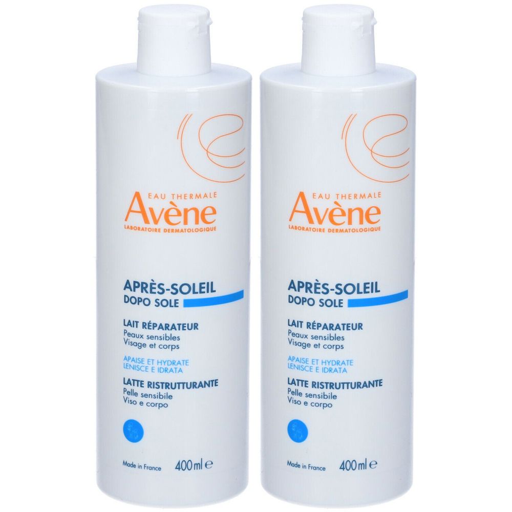 Due flaconi bianchi con etichetta blu. Scritta: Eau Thermale Avène, Après-Soleil, Latte Ristrutturante. 400ml.
