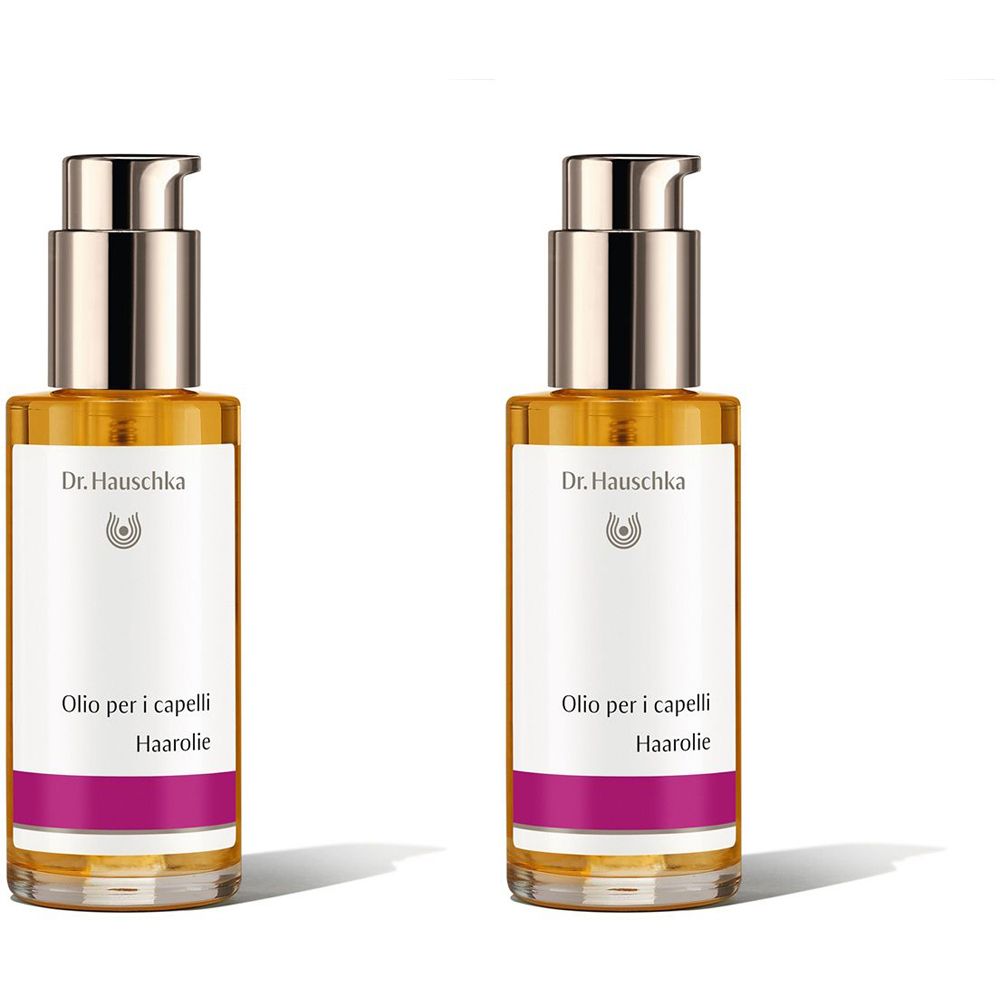 Due flaconi di olio per capelli con dosatore. Scritta: Dr. Hauschka, Olio per i capelli, Haarolie.