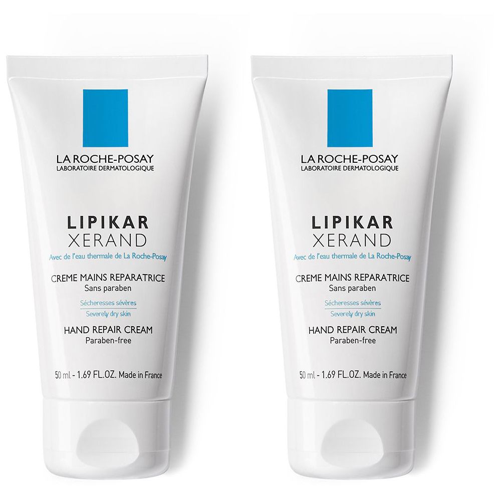 Due tubi bianchi di crema per le mani. Scritta: LIPIKAR XERAND, Crème Mains Réparatrice, Hand Repair Cream. Marchio: La Roche-Posay.