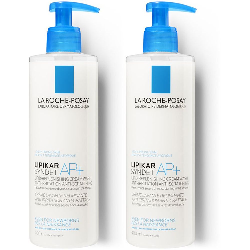 Due flaconi bianchi con dosatore blu. Scritta: La Roche-Posay, Lipikar Syndet AP+.