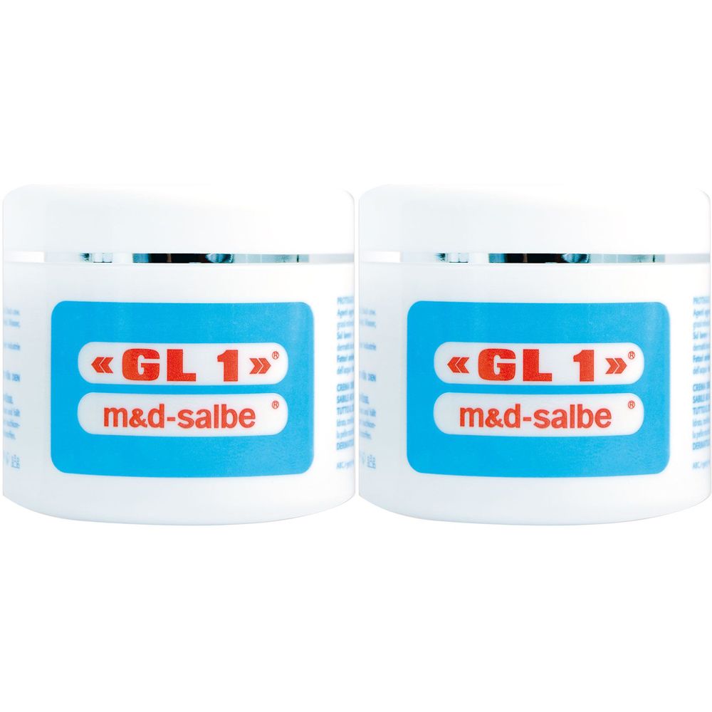 Due vasetti bianchi con etichetta blu. Scritta: «GL 1» m&d-salbe.