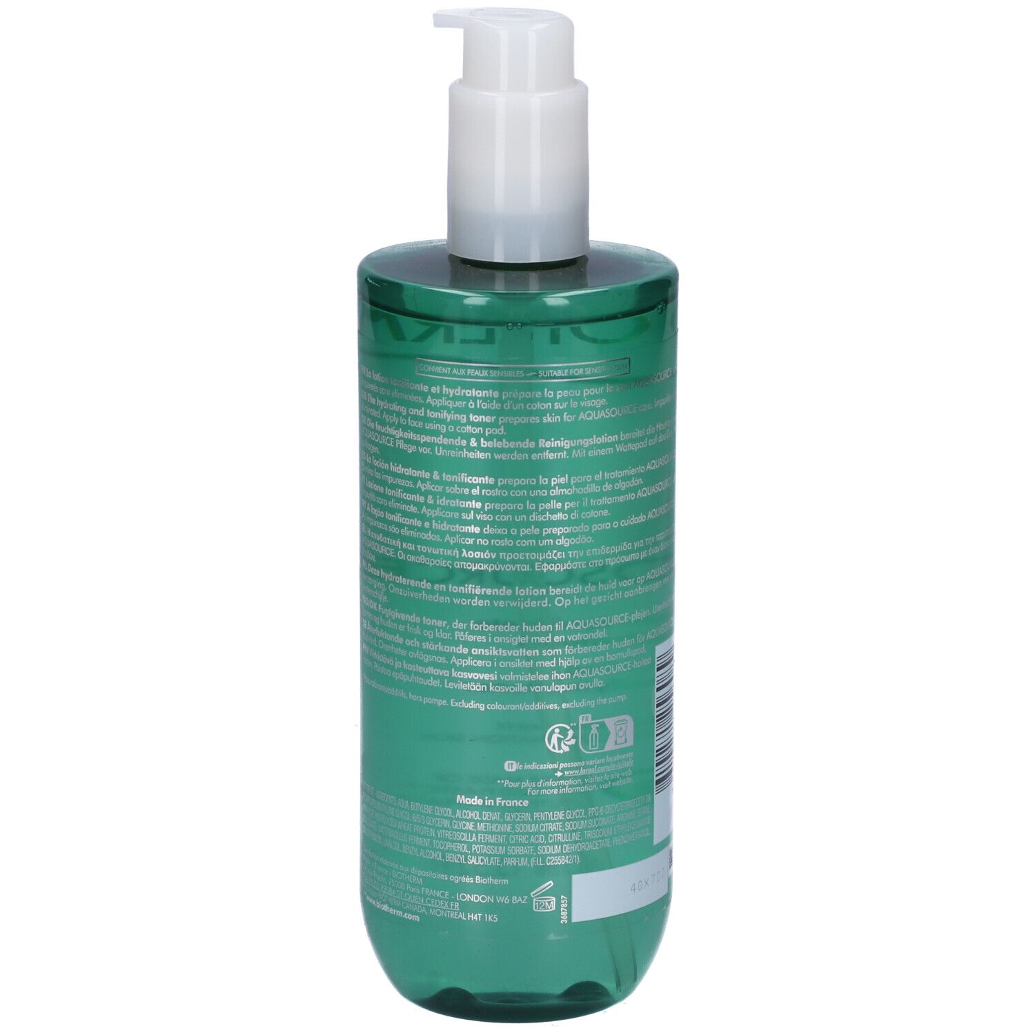 Retro del flacone verde con testo. Erogatore bianco. Codice a barre e altre informazioni.